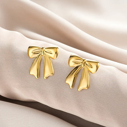 Golden bow-shaped stud earrings with polished metallic finish from ins style affordable luxury gold fashion earring collection Style 35