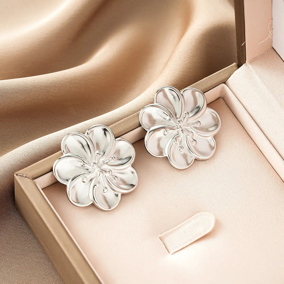 Ins Style silver flower-shaped stud earrings with polished reflective finish from gold fashion earring collection affordable luxury Style 38