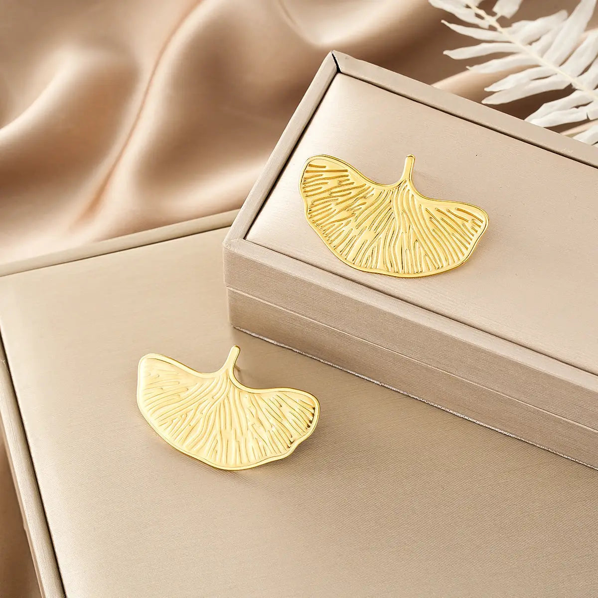 Gold metallic ginkgo leaf-shaped bookmark with intricate veins from ins style gold fashion earring collection affordable luxury Style 41
