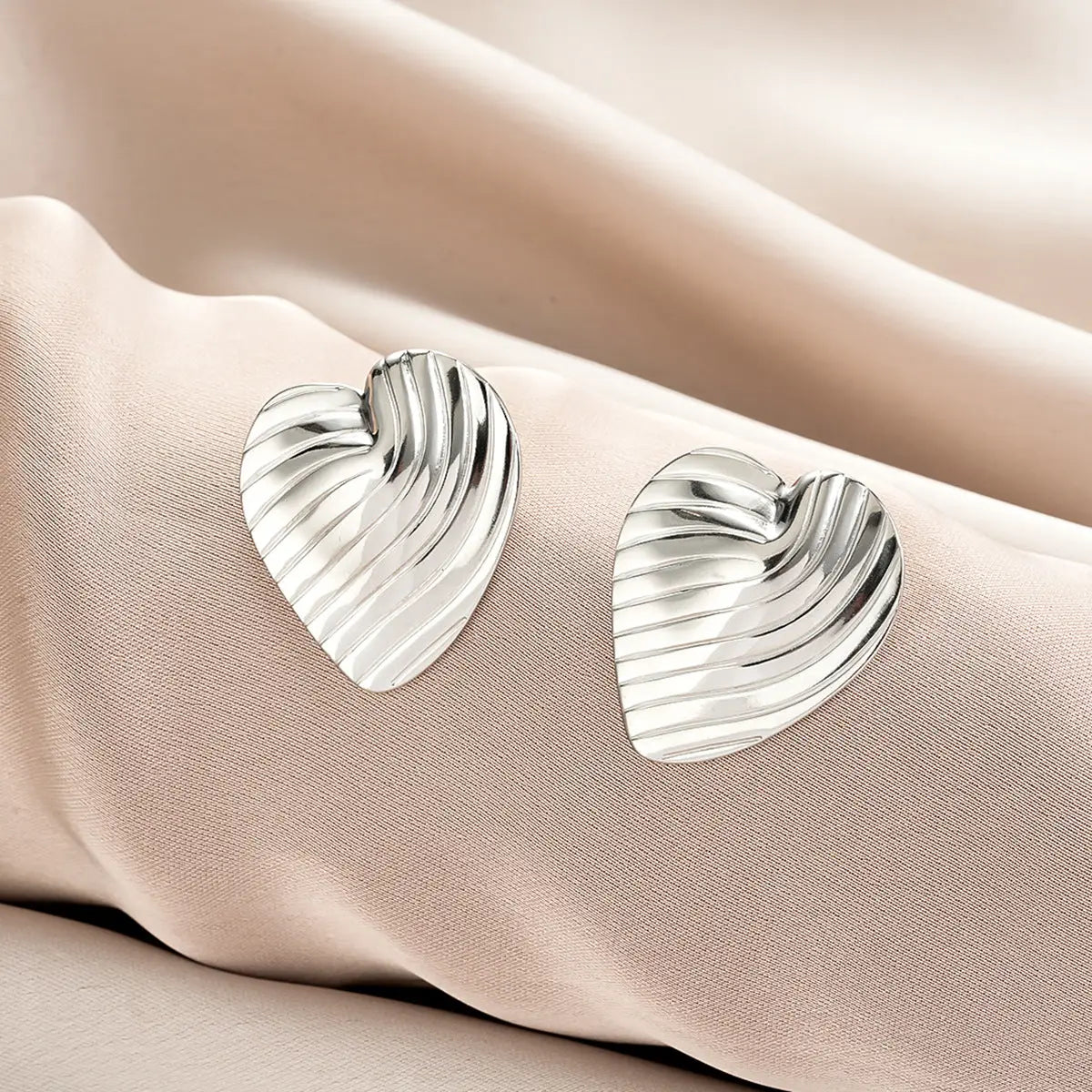 Silver heart shaped earrings with textured ribbed surface from ins style gold fashion earring collection offering affordable luxury Style 45