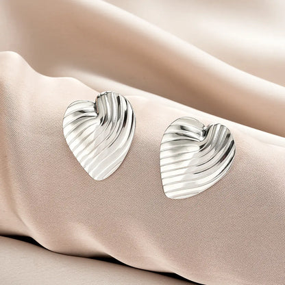 Silver heart shaped earrings with textured ribbed surface from ins style gold fashion earring collection offering affordable luxury Style 45