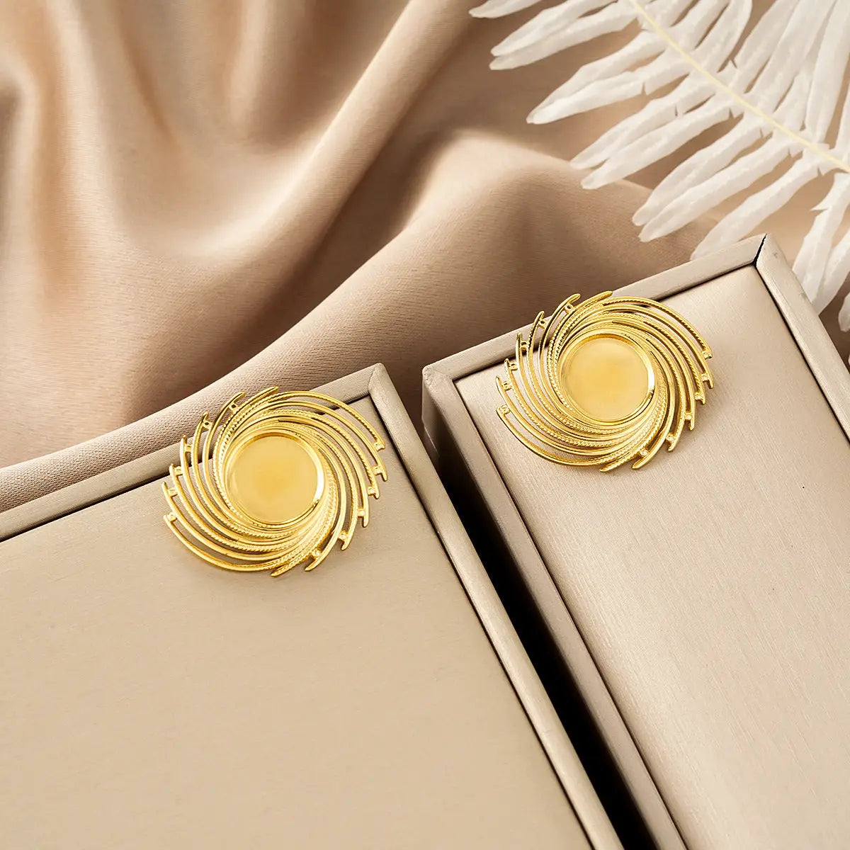 Ins style gold fashion earring collection featuring gold-toned spiral earrings with textured design and amber accent Style 46