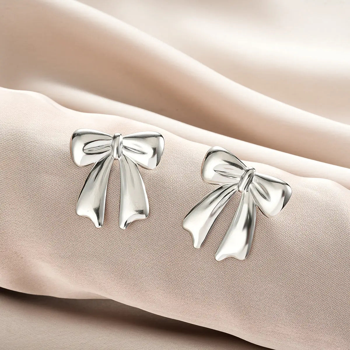 Silver bow-shaped stud earrings with polished finish from ins style gold fashion earring collection affordable luxury Style 48