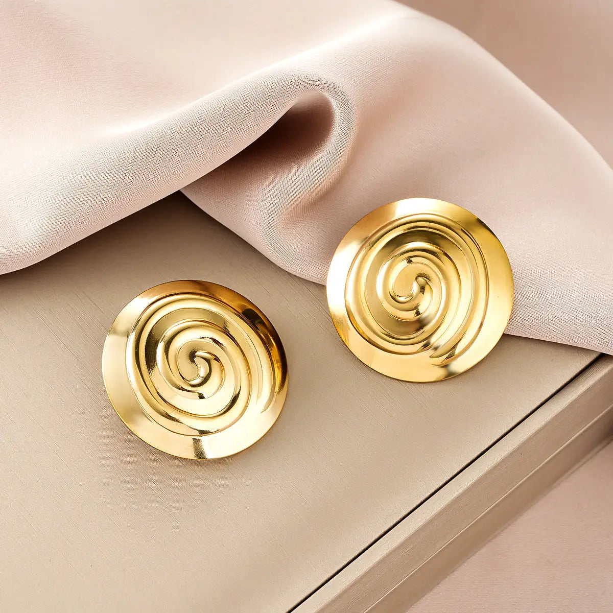 Ins style gold fashion earring collection featuring gold-colored circular stud earrings with a spiral design for affordable luxury Style 5