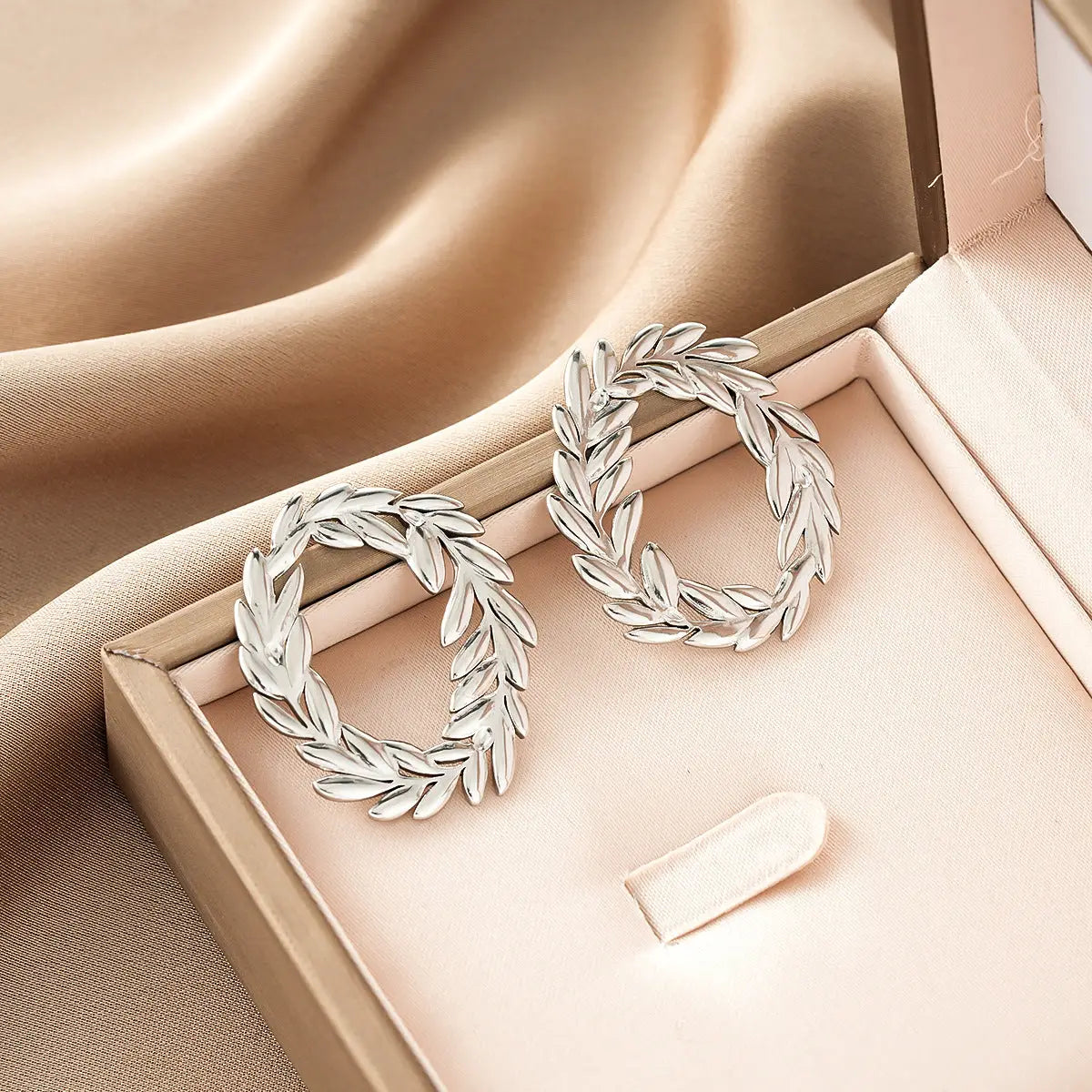 Ins style silver leaf-themed hoop earrings with intricate design from gold fashion earring collection offering affordable luxury Style 50