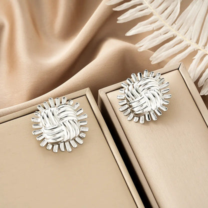 Silver woven knot earrings with sunburst spikes from ins style gold fashion earring collection for affordable luxury Style 52