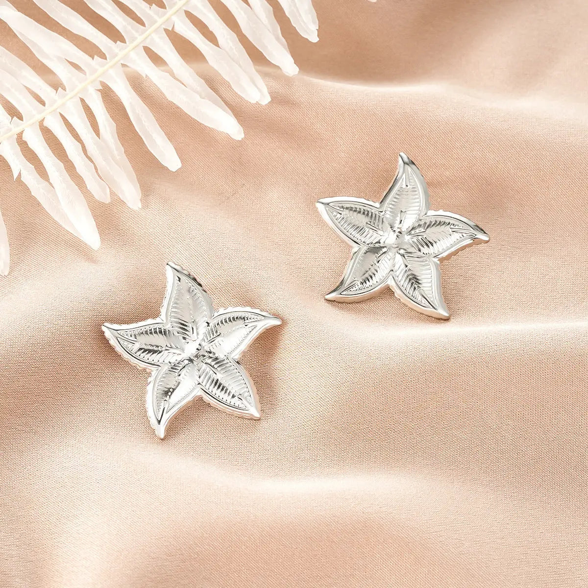 Silver starfish-shaped stud earrings with intricate texture from ins style gold fashion earring collection affordable luxury Style 7
