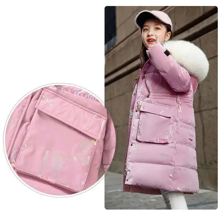 Pink quilted kids long down padded winter coat with white fur-lined hood and multiple front pockets from trend den