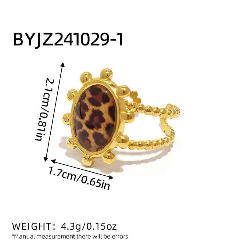 Gold-toned stainless steel adjustable statement ring with leopard print oval centerpiece and beaded band from trend den 1color