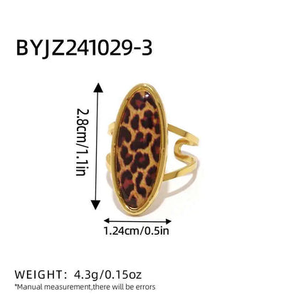 Gold-toned stainless steel adjustable statement ring with oval leopard print inlay from trend den 3color