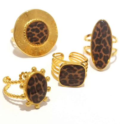 Gold-toned leopard print adjustable statement rings made of stainless steel with various shapes from trend den