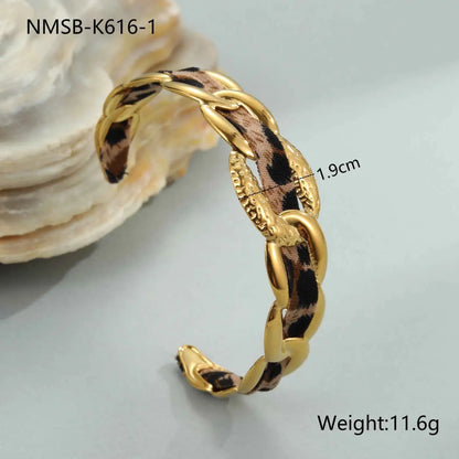Gold-toned chain-link bracelet with leopard ribbon woven through links in leopard ribbon geometric design NMSBK6161