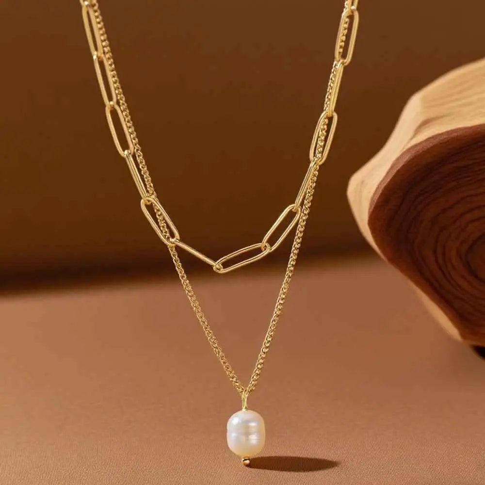 Lumina layered gold necklace with paperclip links and a single white pearl pendant in a delicate layered gold chain design Gold