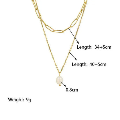 Gold-toned lumina layered necklace with delicate chain and oval-shaped pearl pendant featuring layered gold chain design