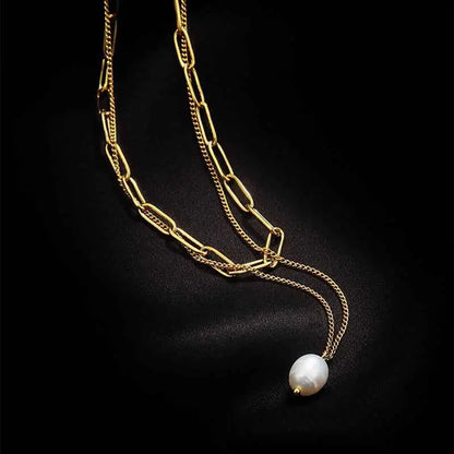 Lumina layered gold chain necklace with layered gold chains and a single white pearl pendant for elegant wear