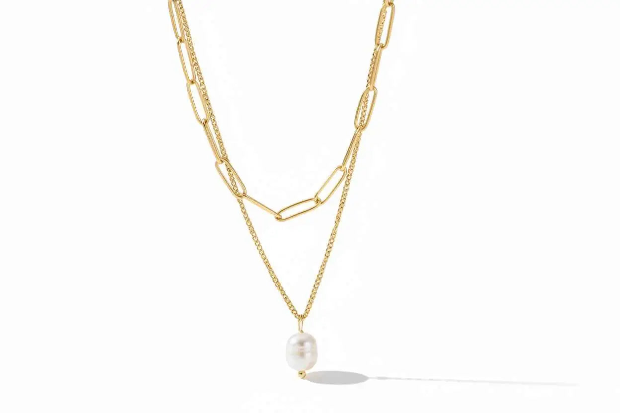 Gold-toned lumina layered gold double-layer necklace with delicate chain and oval freshwater pearl pendant