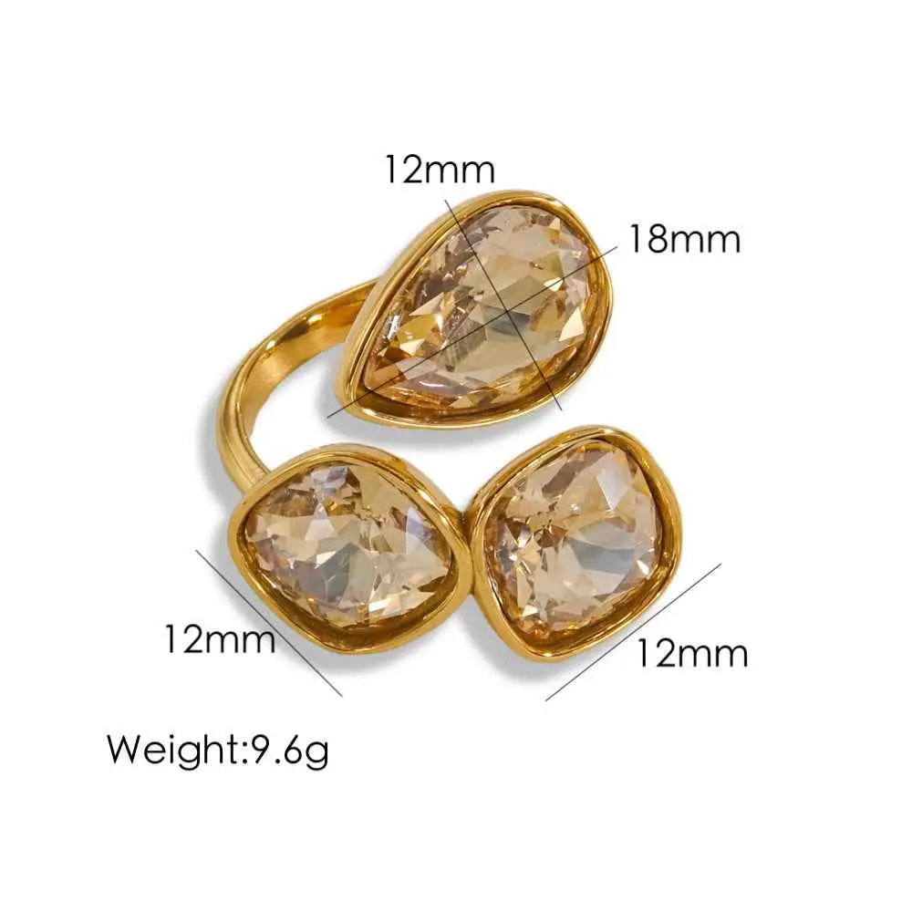 Luxury multi-stone zircon ring with gold-toned stainless steel open band and three amber-hued faceted crystals from trend den Champagne