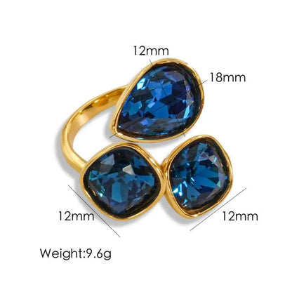 Gold-toned luxury multi-stone zircon ring with three blue teardrop and square-cut gemstones weighing 9.6g Dark Blue