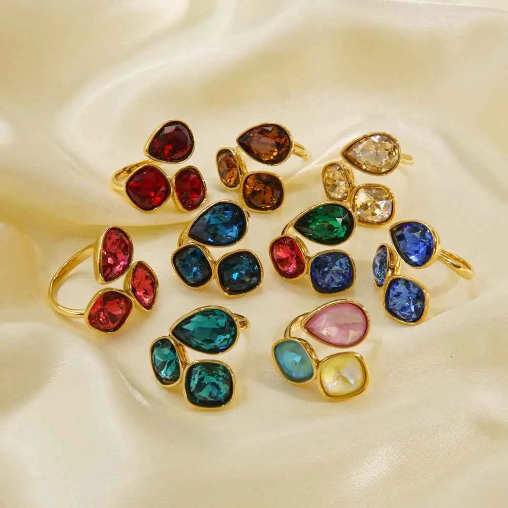 Luxury multi-stone zircon ring with vibrant red blue green teardrop gemstones in gold-toned stainless steel by trend den