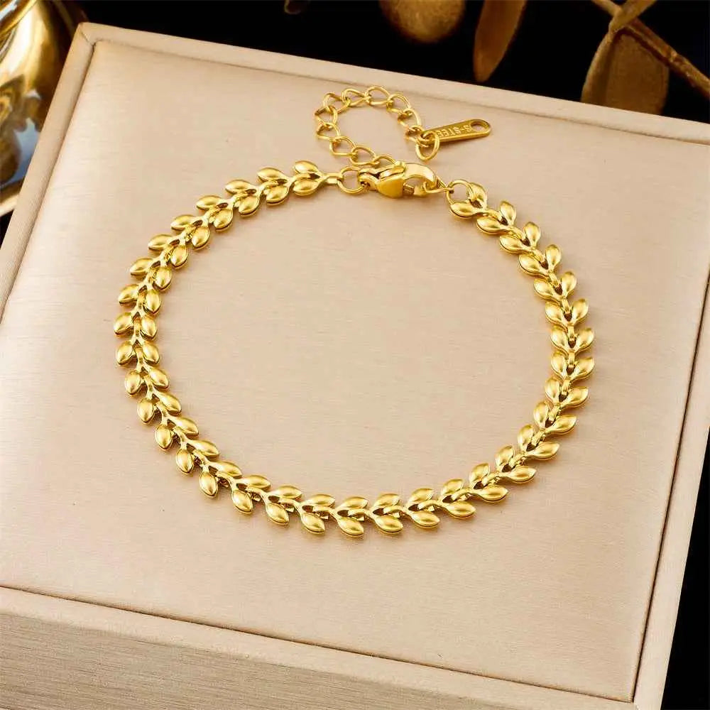 Luxury titanium steel fashion bracelet from trend den with gold leaf pattern polished metallic finish and secure clasp 5114 Wheat
