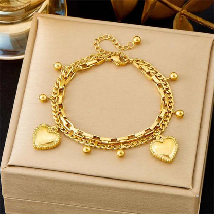 Gold-toned titanium steel charm bracelet with layered chains heart pendants and beads from trend den fashion bracelet collection 512 Round Beads Love