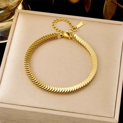Gold-colored titanium steel snake chain fashion bracelet with interlocking design and secure clasp from trend den collection 5123 Wafer Chain