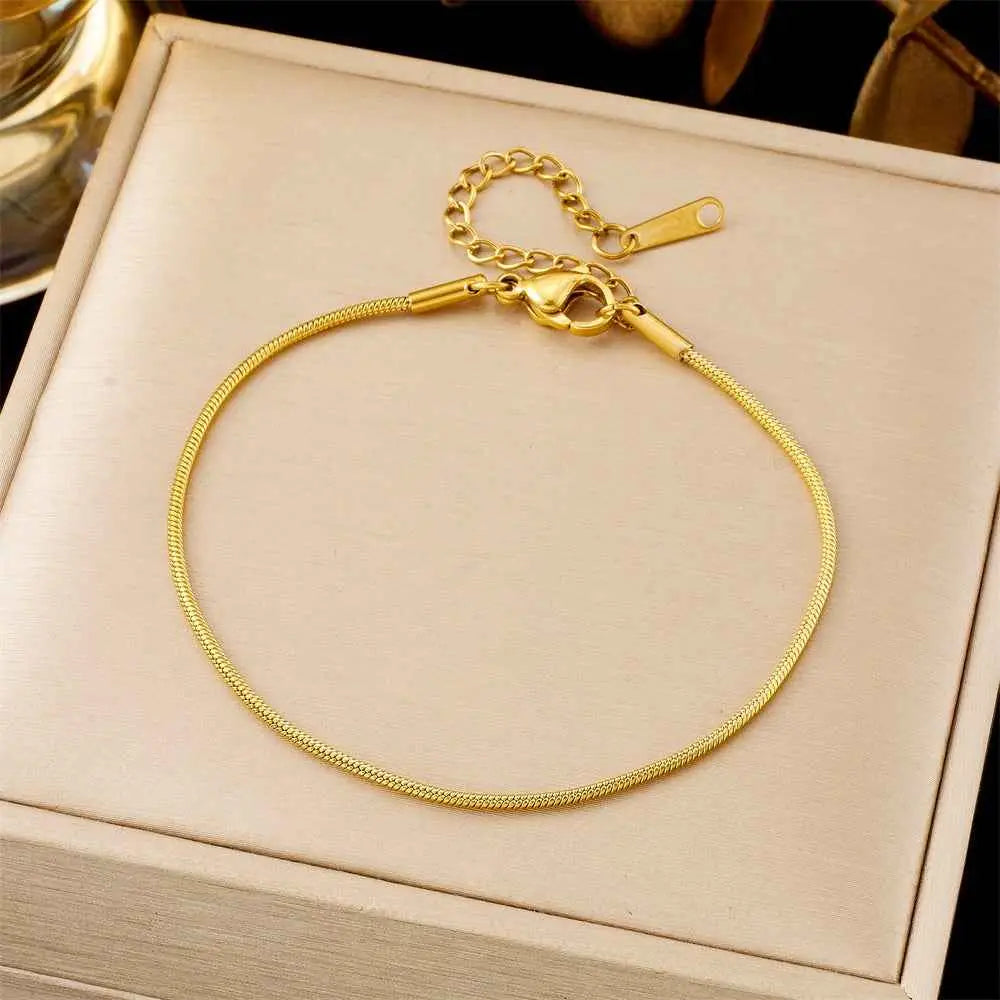 Gold-colored titanium steel snake chain fashion bracelet with secure clasp and adjustable extension from trend den collection 5136 Snake Chain