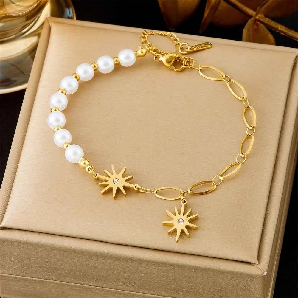 Gold-toned titanium steel fashion bracelet from trend den featuring white pearls and star charms with clear gemstones 5144 White Pearl SUNFLOWER