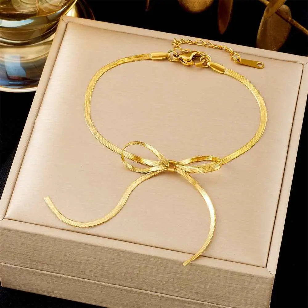 Gold snake chain anklet with delicate bow knot from luxury titanium steel fashion bracelet collection by trend den 5161 Bow