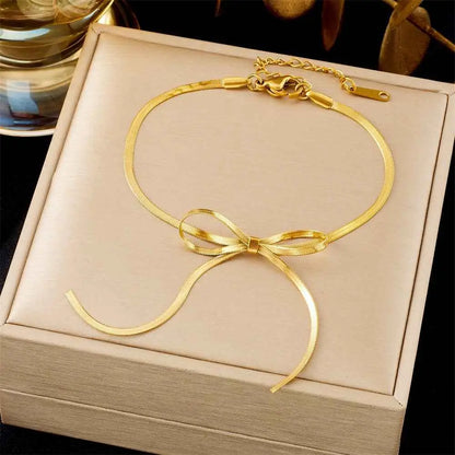 Gold snake chain anklet with delicate bow knot from luxury titanium steel fashion bracelet collection by trend den 5161 Bow