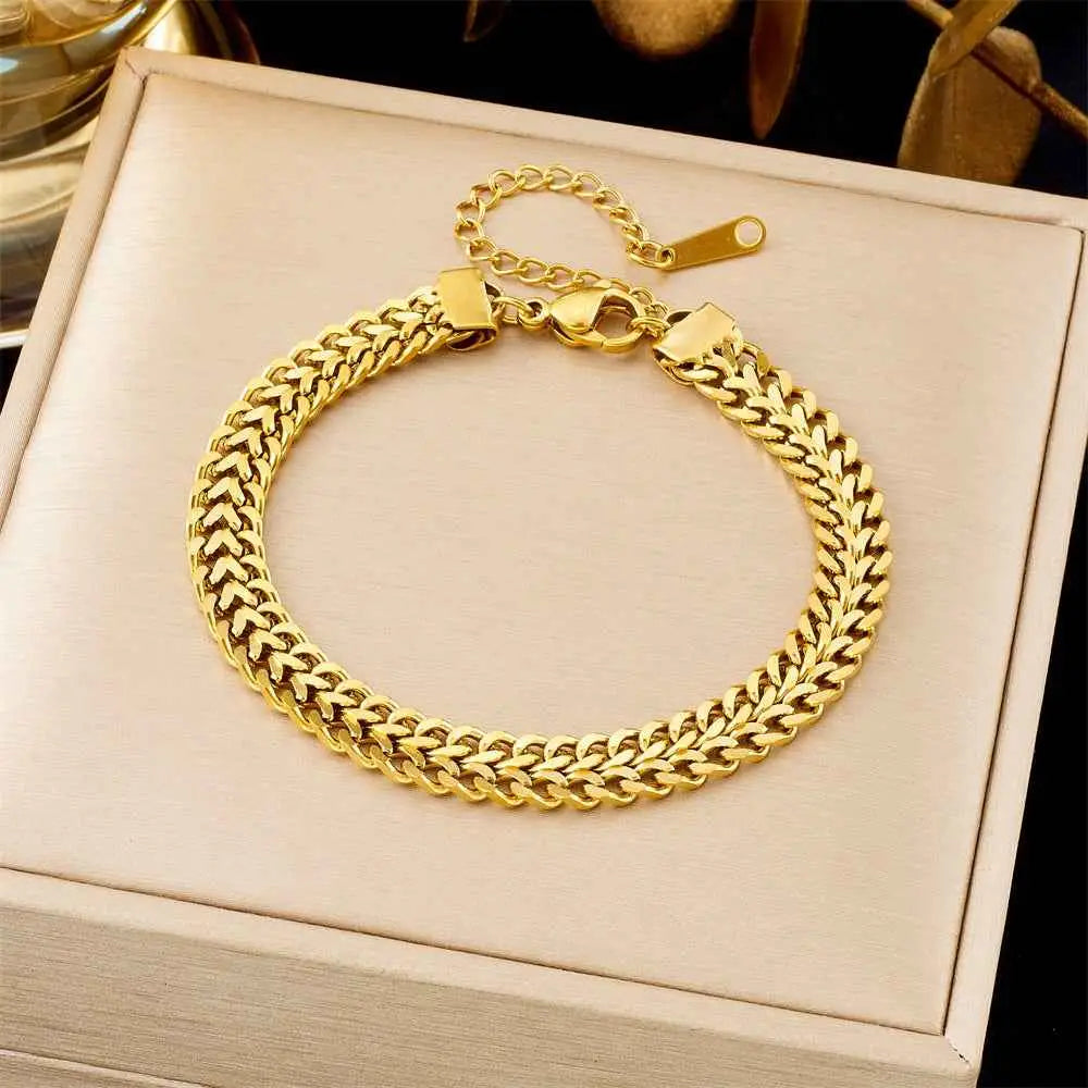 Gold-toned braided titanium steel fashion bracelet with secure clasp and adjustable extension from trend den collection 5169 Braided Chain