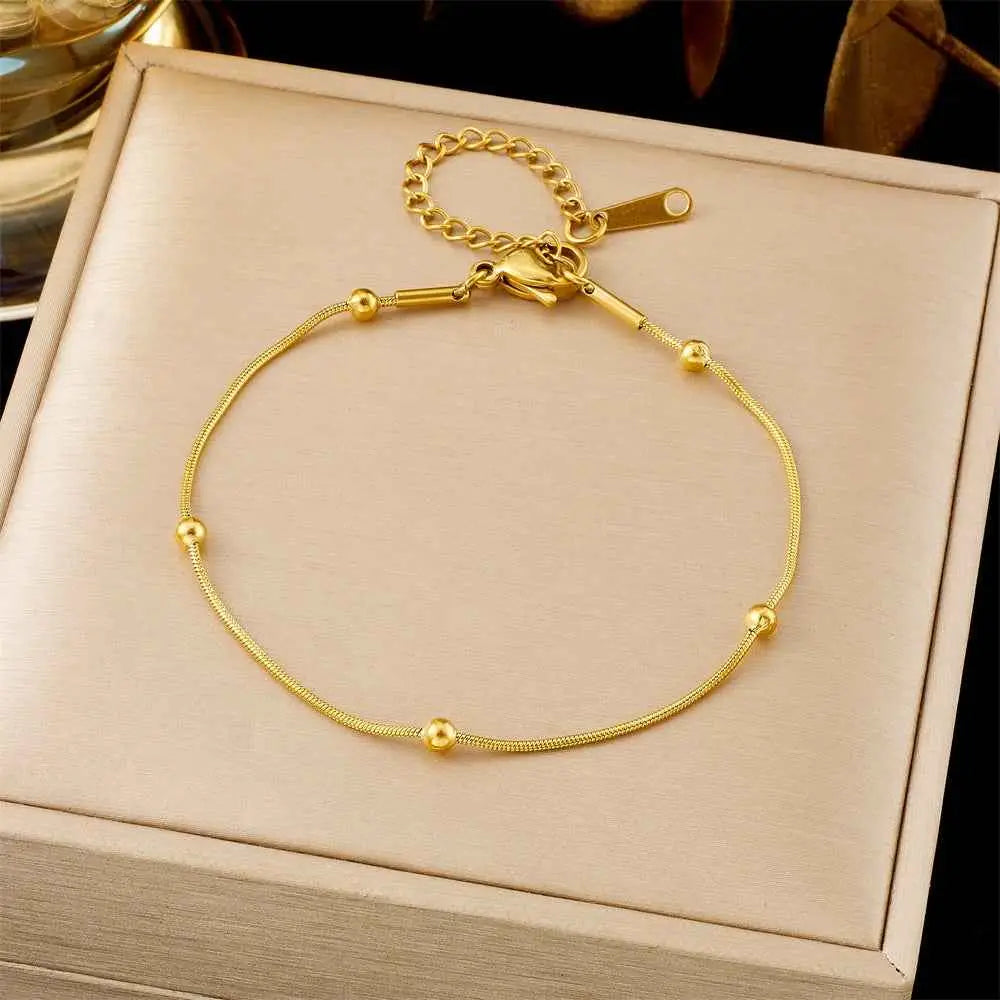 Gold-toned titanium steel snake chain anklet with small beads and clasp from trend den fashion bracelet collection 5201 Round Beads Chain