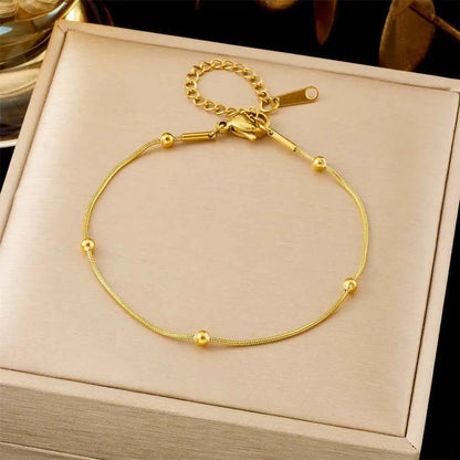 Gold-toned titanium steel snake chain anklet with small beads and clasp from trend den fashion bracelet collection 5201 Round Beads Chain