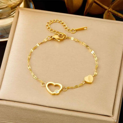 Gold-toned heart-shaped titanium steel bracelet with diamond charm and adjustable clasp from trend den fashion bracelet collection 5212 Double Love Lip Chain