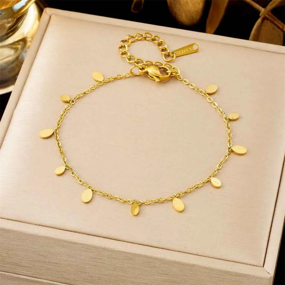 A delicate gold-toned titanium steel anklet with flat oval charms from the luxury fashion bracelet collection trend den 5250 Water Droplets