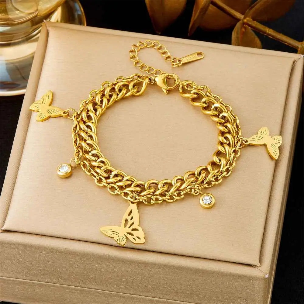 Trend Dens Gold chain bracelet with butterfly charms on a beige jewelry box 5293 Hollow Butterfly