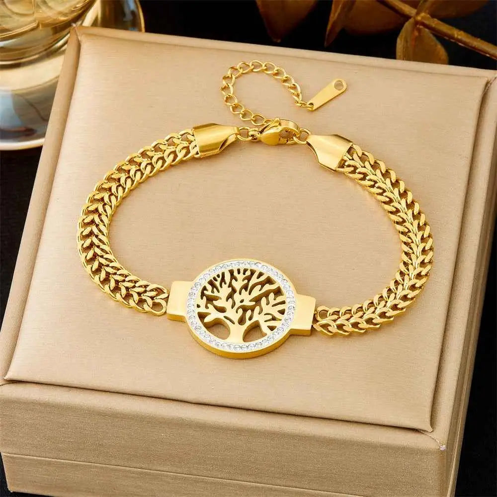 Gold bracelet with tree of life design on a beige box 5348 Lucky Tree Braided Chain