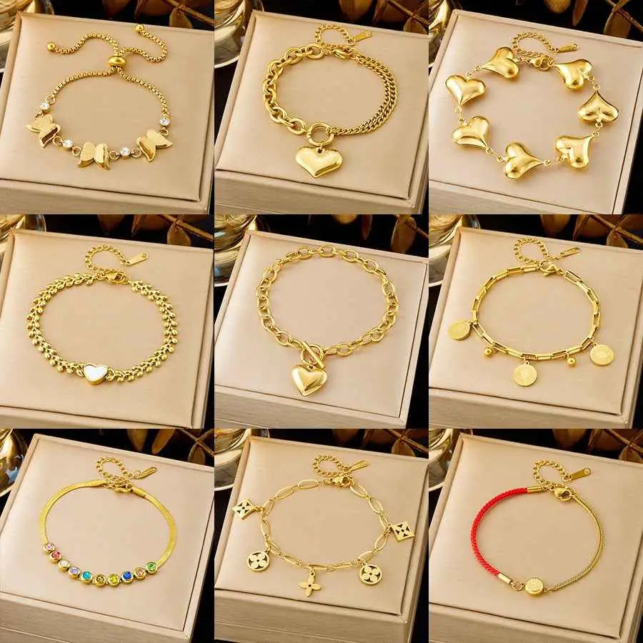 Gold-toned heart-themed charm bracelets with colorful gemstones and red cords from luxury titanium steel fashion bracelet collection