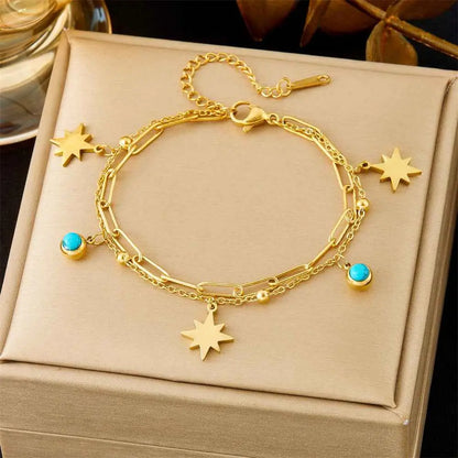 Gold-toned star and turquoise charm titanium steel paperclip fashion bracelet from luxury fashion bracelet collection trend den