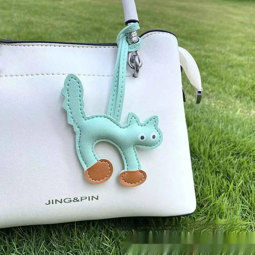 Mini cat bag charm in mint green leather with brown paw pads perfect for trend den cat bag or handbag pendant use Lake Blue