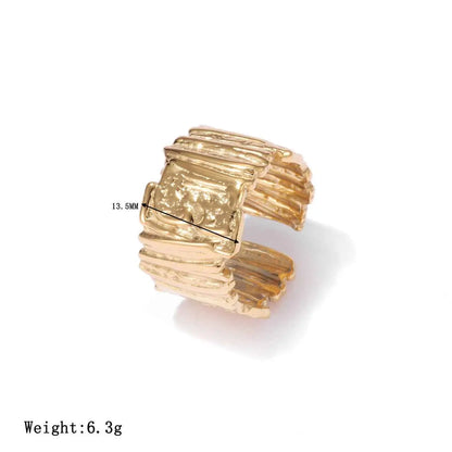 Gold-toned minimalist geometric adjustable ring in titanium steel with textured layered rectangular design and embossed panel Gold