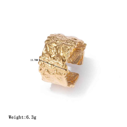 Gold-toned textured cuff bracelet with rugged sculptural design made of titanium steel for geometric adjustable style Gold