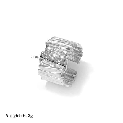 Minimalist geometric adjustable ring in silver-tone titanium steel with a textured layered sculptural design Silver