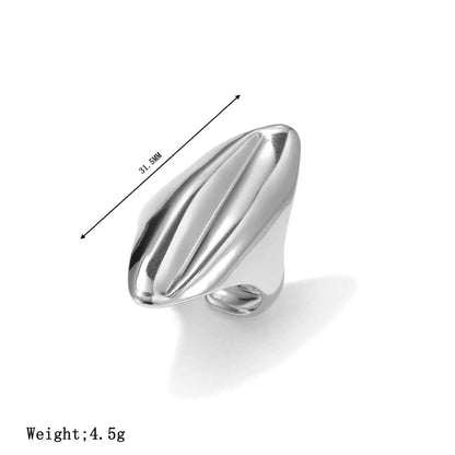 Minimalist geometric adjustable ring in silver titanium steel with sleek flowing curves and subtle vertical grooves from trend den Silver