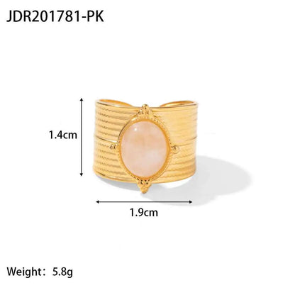 Gold-toned cuff bracelet with ribbed band and oval pink rose quartz stone in an ornate bezel natural stone trend den JDR201781 PK
