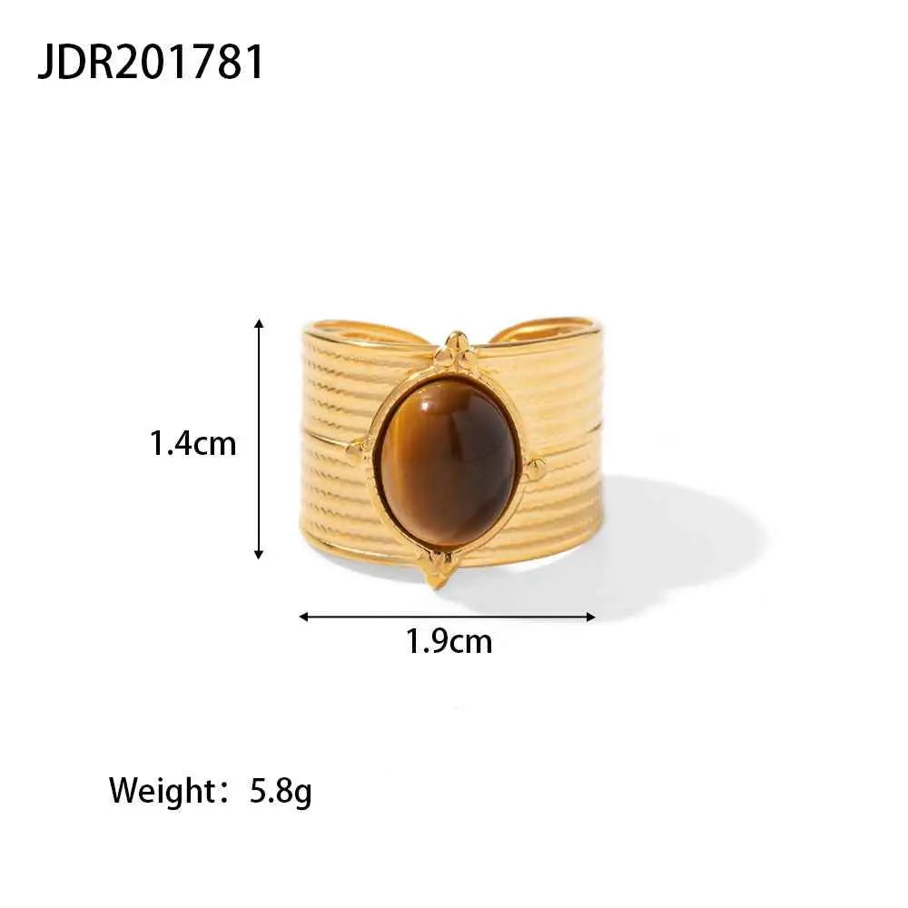 Gold-toned cuff bracelet with central oval tiger’s eye natural stone on textured band from trend den adjustable zircon collection JDR201781