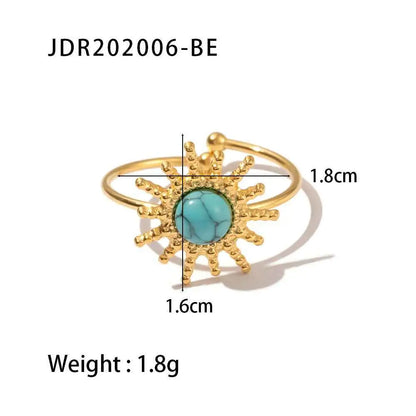 Gold-toned natural stone adjustable zircon ring with a turquoise center and textured sunburst rays trend den design JDR202006 BE