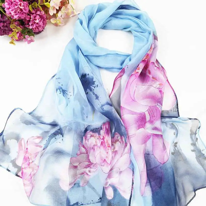 A delicate light blue silk georgette sunscreen scarf with oil painting floral pink peony blossoms and watercolor brushstrokes A