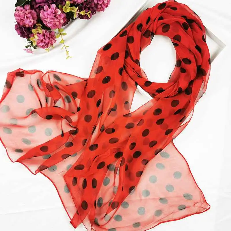 A vibrant red sheer georgette sunscreen scarf with bold black and gray polka dots in oil painting floral style A