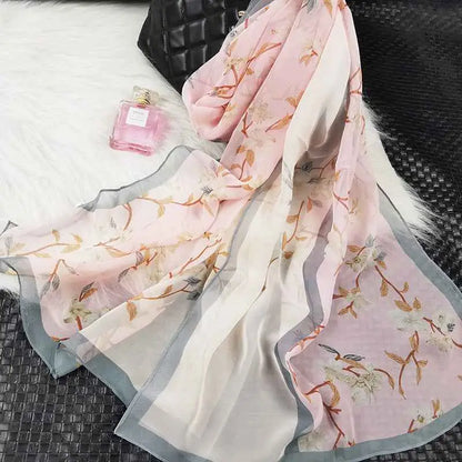 A delicate pink and white oil painting floral georgette sunscreen scarf with soft sheer fabric and subtle gray border A